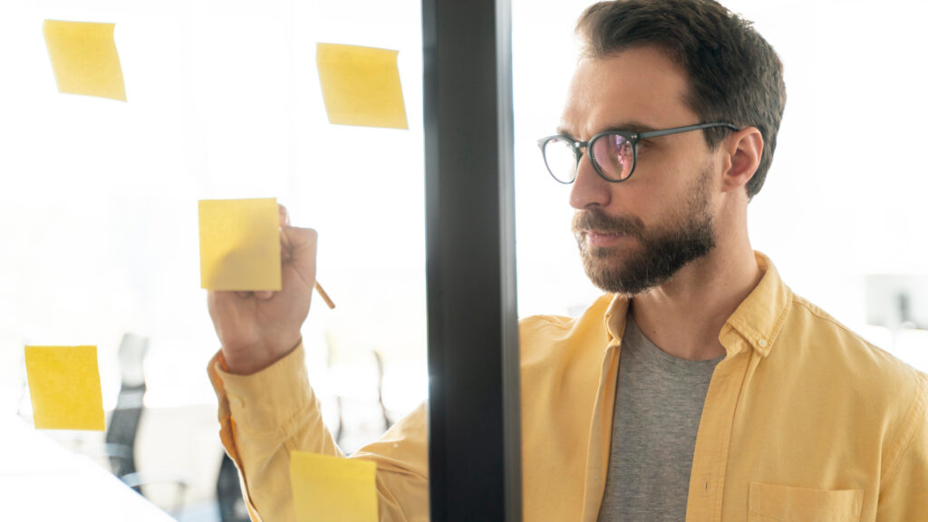 man using skills to write notes